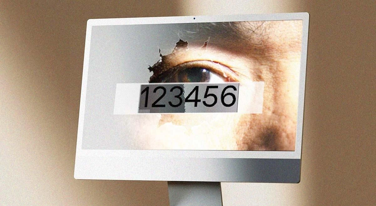 Bilgisayar ekranında “123456” parolası ve ekranda görünen bir göz