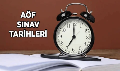 AÖF sınav tarihleri yazısının yanında açık kitapların üzerinde bir çalar saat