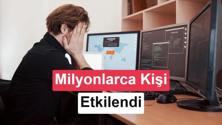 Bilgisayar başında başını ellerinin arasına almış kişi; ekranda “Milyonlarca Kişi Etkilendi” yazısı