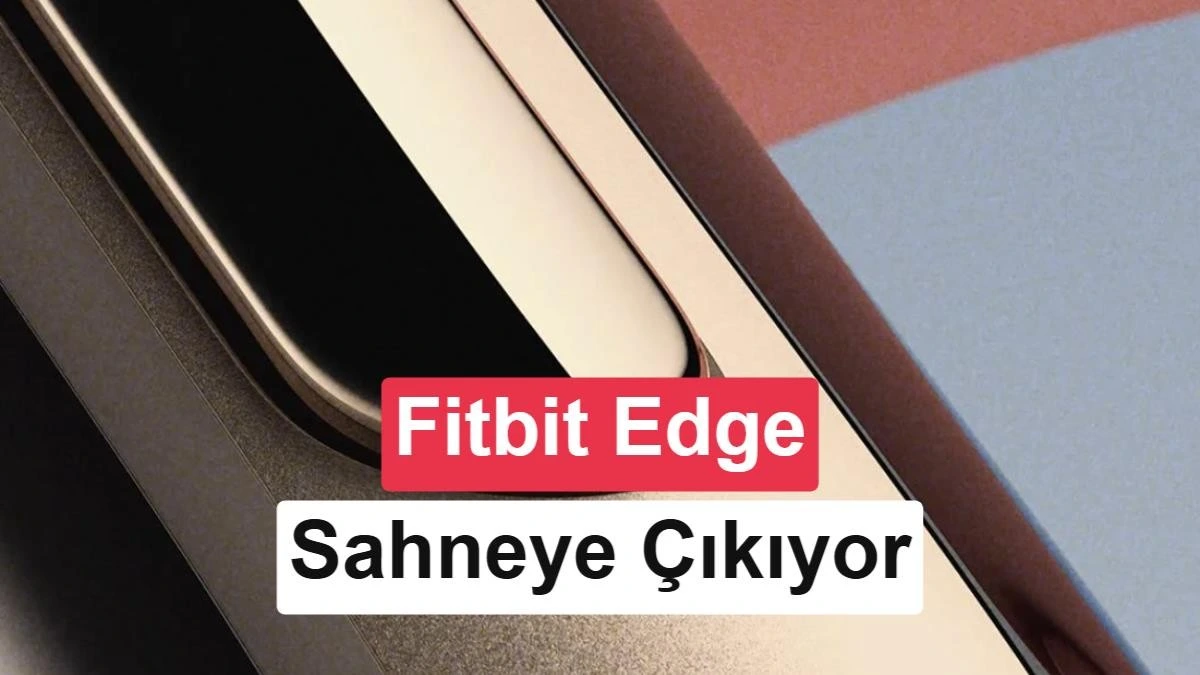 Fitbit Edge olduğu belirtilen giyilebilir cihazın altın tonlu kasası, ekranı ve yuvarlak düğmesinin yakın plan görünümü