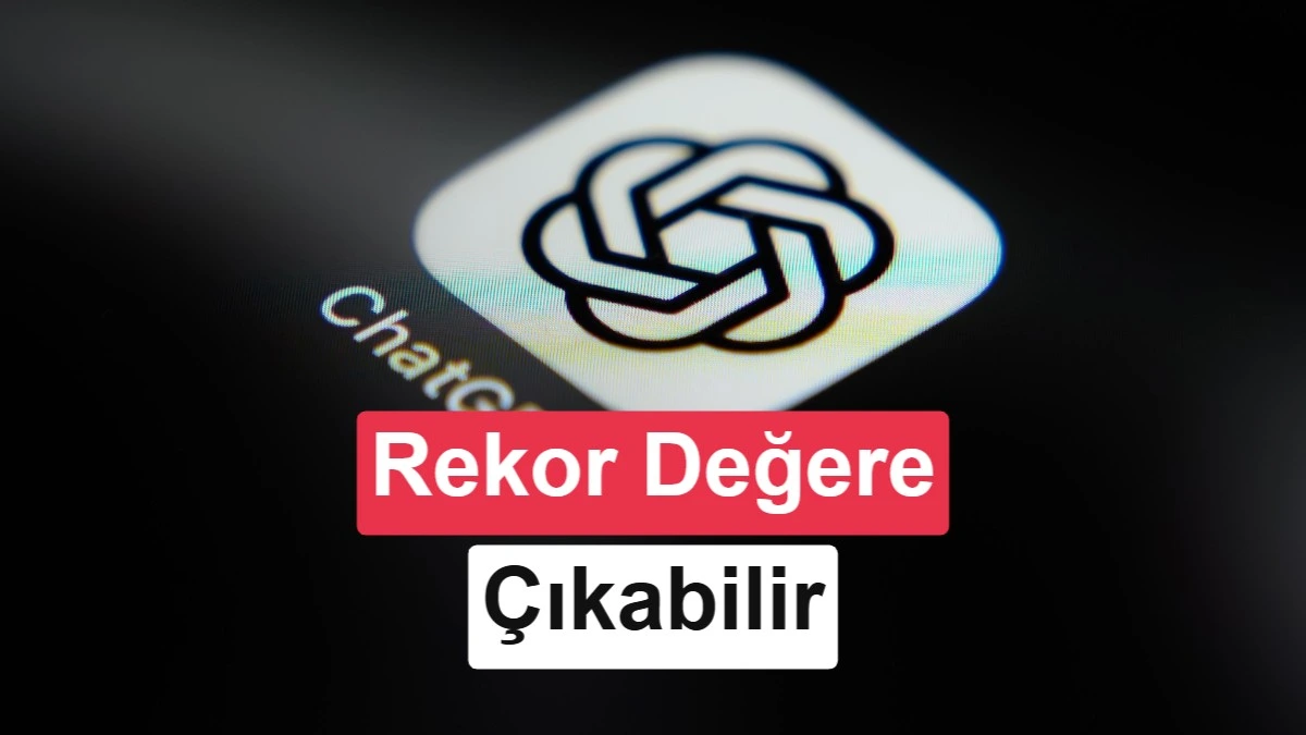 Sam Altman, arka planda OpenAI yazısı bulunan bir ekranın önünde