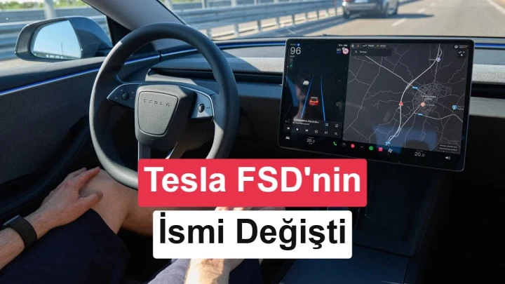 Tesla otomobilinin içinden görünen direksiyon ve orta ekrandaki sürüş arayüzü