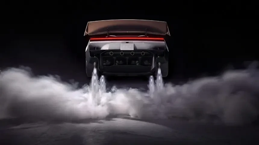 İticilerinden duman ve ışık çıkan Tesla Roadster'ın arkadan görünümü
