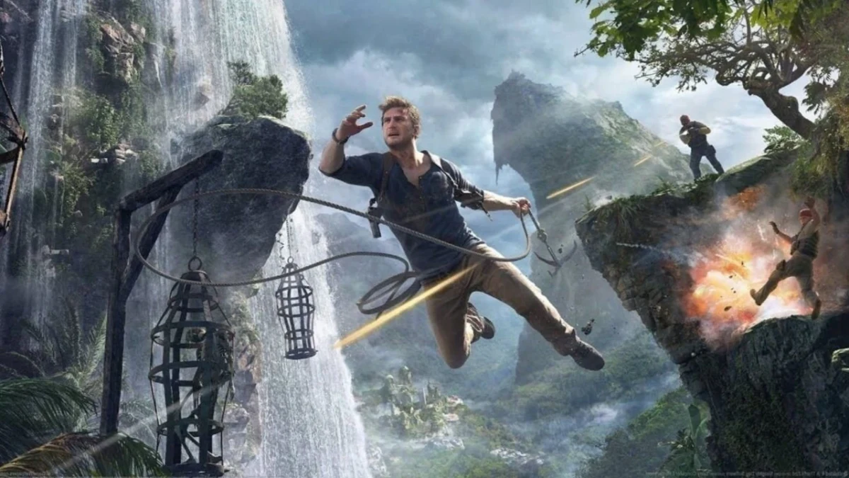 Uncharted görselinde Nathan Drake, kayalık bir ortamda ipten sarkarken görülüyor.