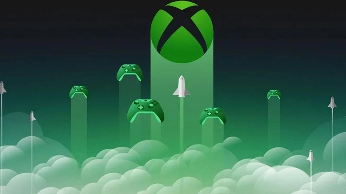 Yeşil Xbox logosu ve bulutların üzerinde yükselen oyun kumandaları